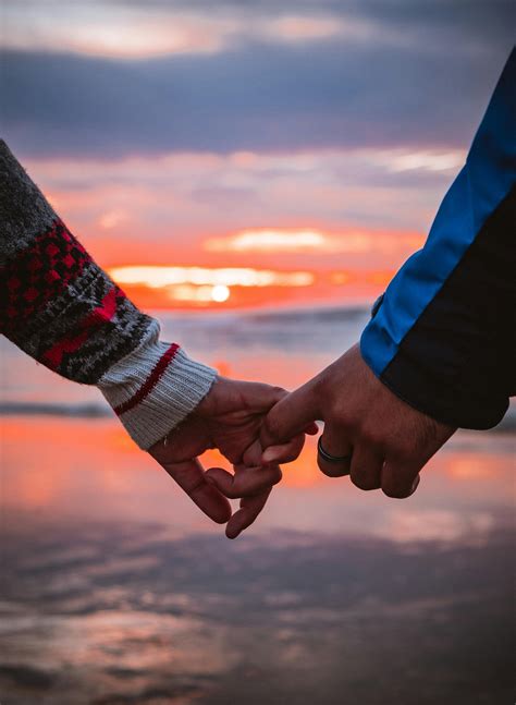 hand holding picture couple